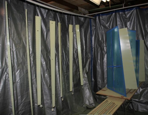 Primed Parts Hanging in my Garage Paint Booth