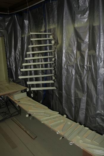 Primed Parts Hanging in my Garage Paint Booth