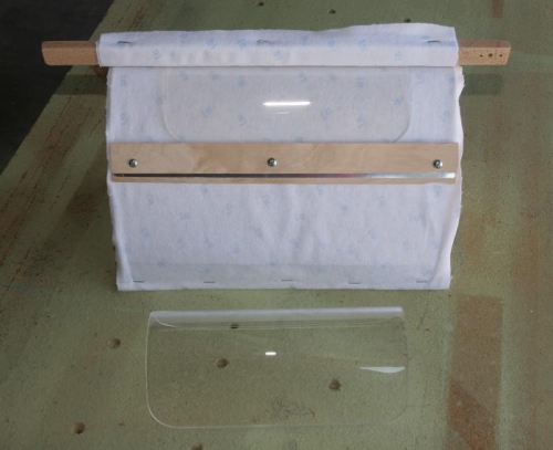 Two Finished Lenses - One on the Form, One on the Table