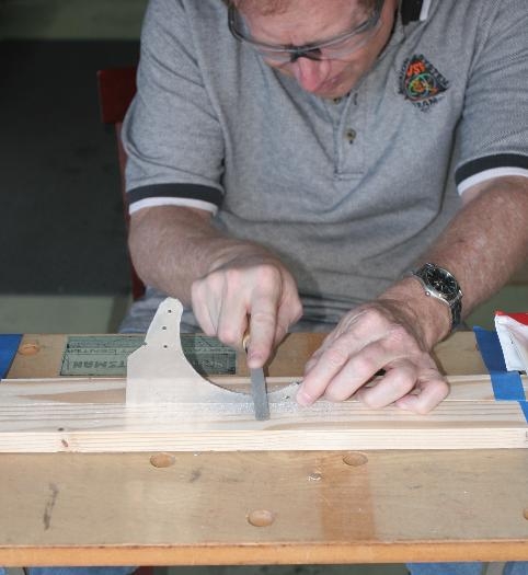 Using a small Half-Round File to De-Burr a Landing Light  Bracket