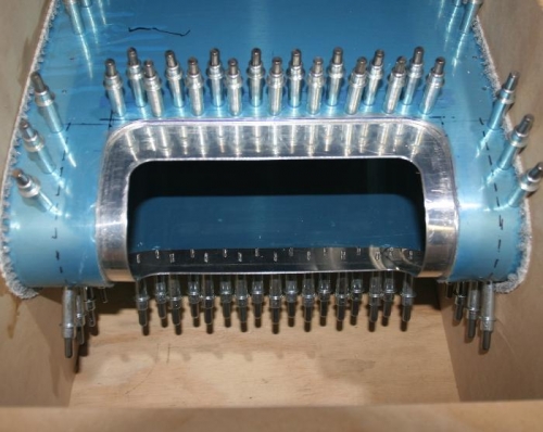 Landing Light Lens Support Frame and Shims Cleco'd to Left Leading Edge