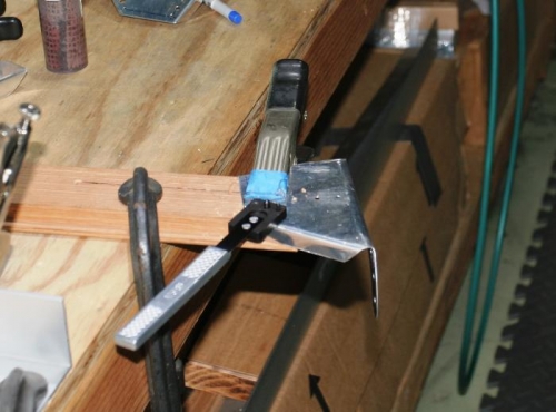 Using a Platenut Jig to Drill holes for the Platenut that will Mount the Landing Light Mounting Plate