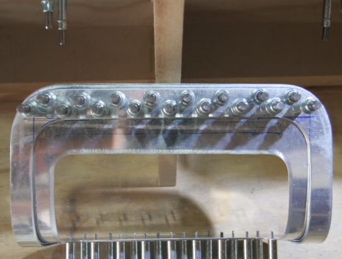 Landing Light Lens Frame Clecoed to Show Excess Material