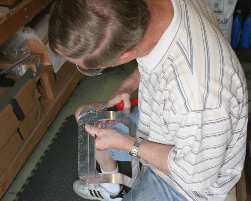 Using Metal Snips to Remove the Excess Material