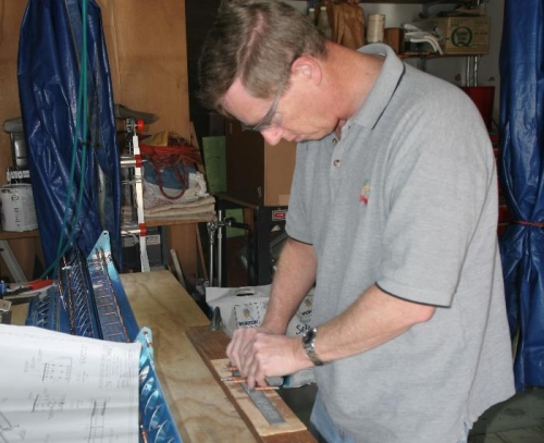 Finsihing the Aileron Brackets with my VIxen File in the Homemade Frame