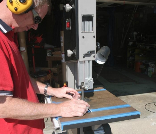 Using Band Saw to Cut Flap Drive Bracket Component from Aluminum Angle