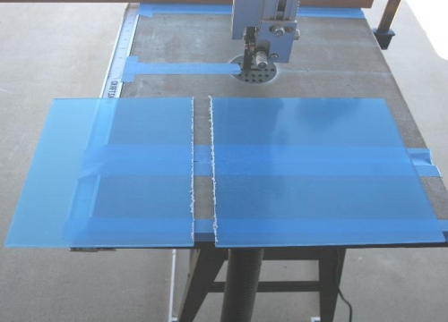 The Bandsaw cuts and melts its way through the Plexiglas,  The White Material is Broken Off by Hand