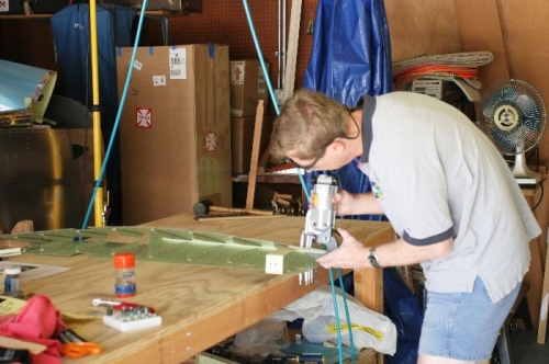 Riveting Left Elevator Counterbalance Strap to Skin