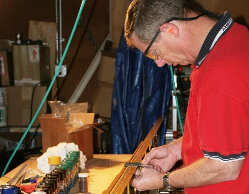 Checking the Fit of the Completed Countersink with a Sample Wing Fuel Tank Dimple.