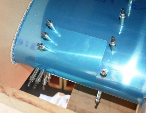 Clecos in the Holes in the Top of the Leading Edge for the Stall Warning Sensor Bracket