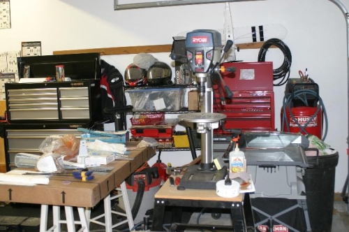 The drill press will have a new home on the new workbench under the cabinents.
