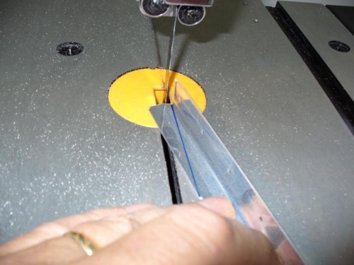 Cut stiffeners with band saw.