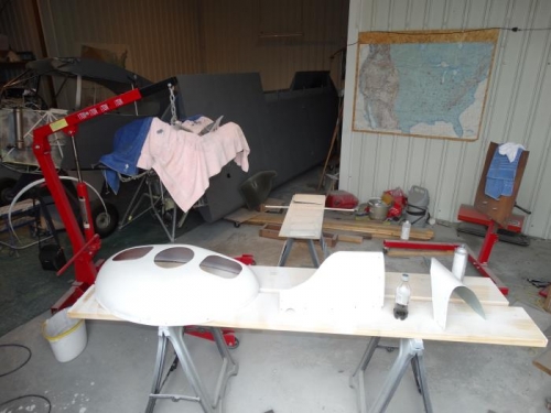 Nose bowl and wing root fairings primed and sanded.