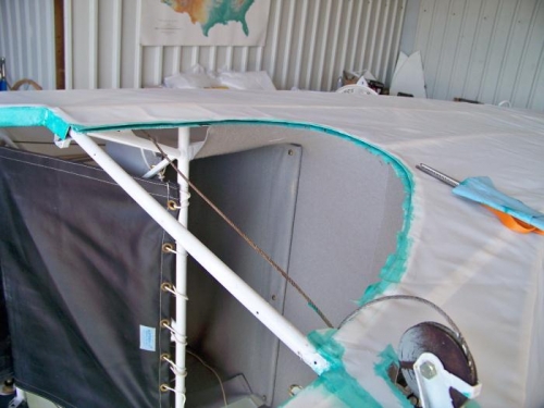 Initial gluing of the side fabric into the rear window slot