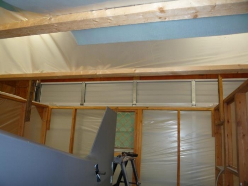 Rear of the paint booth opened up for the ceiling raising.