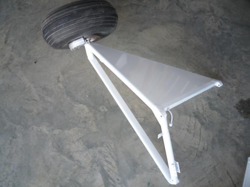 Gear assembly with brakes and wheel back on for good.