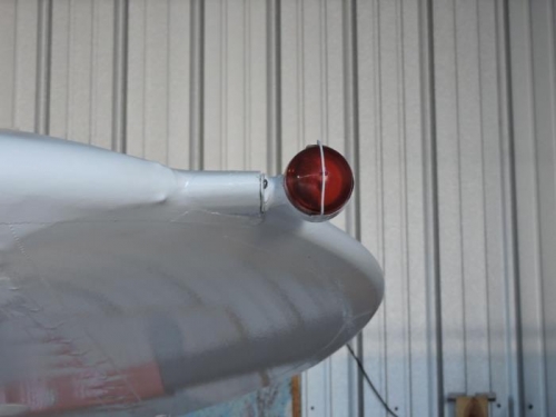 Left wing tip nav light.