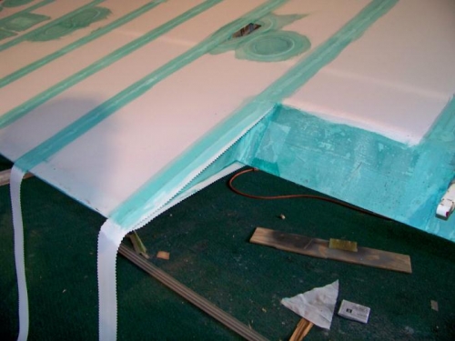 Trimming the tapes ends to fit the edges.