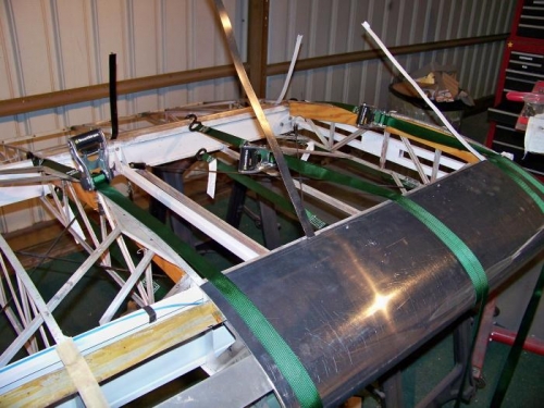 Straps holding the inner skin in place while screws are installed.