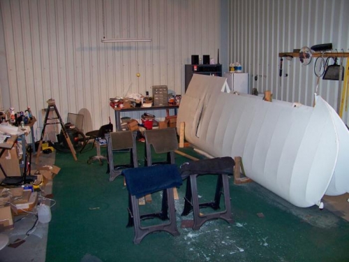 Hangar minus one fuselage & ready for the wings.