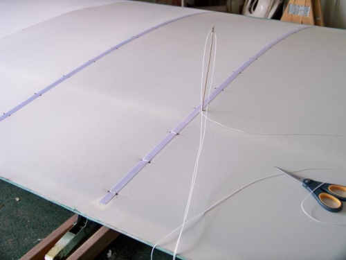 Working my way up one of the aileron ribs.