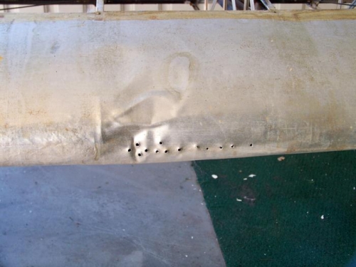 The right leading edge where the  impact took place, and the resulting repair effort.