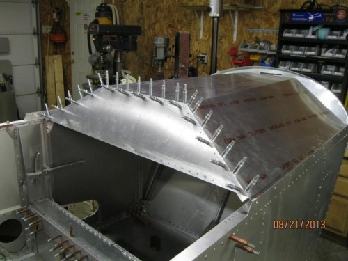 Glareshield and instrument panel resting on fuselage.