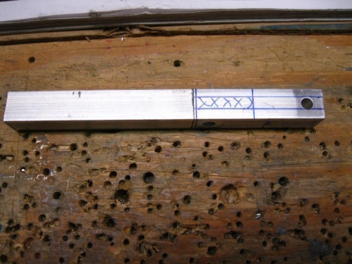 Bar stock. Drilled 3/16 holes.