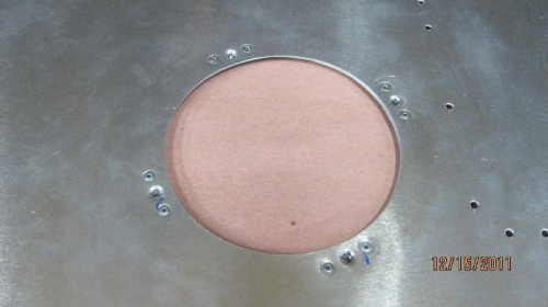 Bottom skin with ring and nut plates riveted.