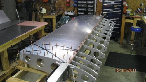 Top skin riveted except for the wing walk area. The wing walk is installed later.