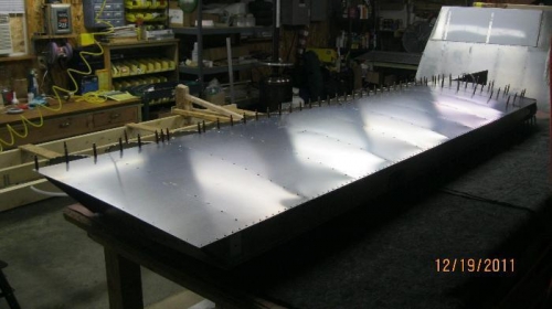 Top wing skin now riveted except for the doubler.