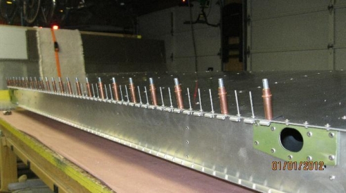 Flap hinge clecoed, ready to rivet.