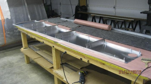 Right and left longeron drilled and clecoed to skin.