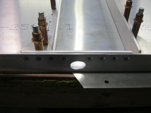 Countersunk rivets with doubler on right longeron.