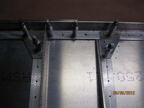 Angles and gussets pilot drilled.