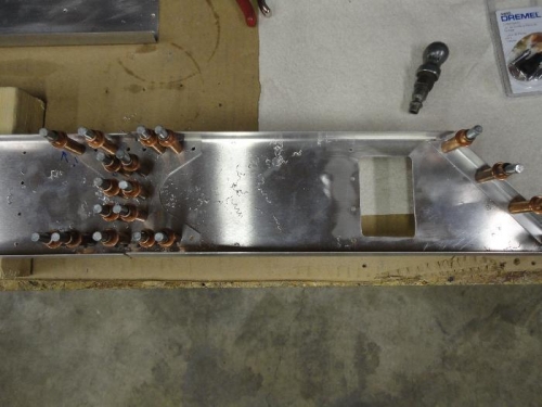 Up-drilled outboard rear spar