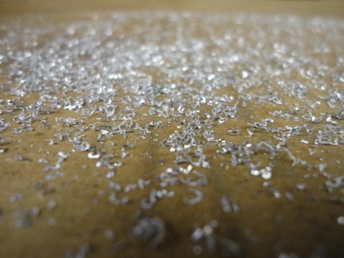 Shavings from deburring 336 holes.