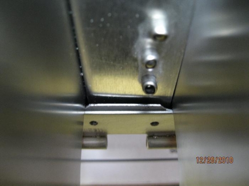 looking at gap between skin/hinge and the aileron spacer.