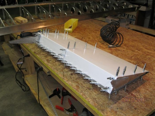 Drilled ribs and Clecoed.