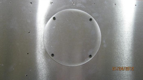 Outside skin showing access hole cover.