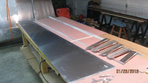 Left aft fuselage is all updrilled and ready to start deburring.