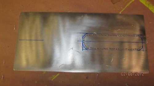 Cut the plate to size and marked the cutouts for the aft fuselage bulkhead.