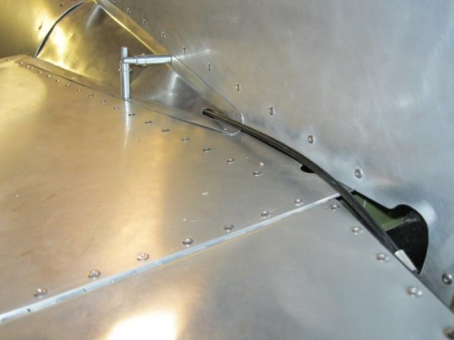 Cable runs through hole in elevator fairing.