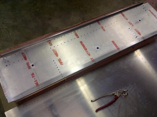 Holes in aft web tunnel assembly will be dimpled and the angles will be counter sunk.