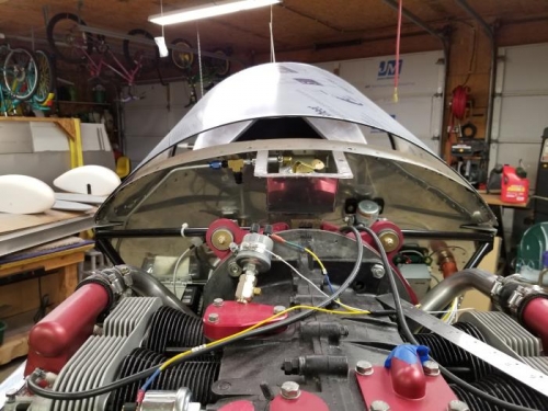 2.5 inches above the upper firewall strap.