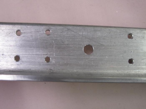 Aft attach angle and centered block pin hole.