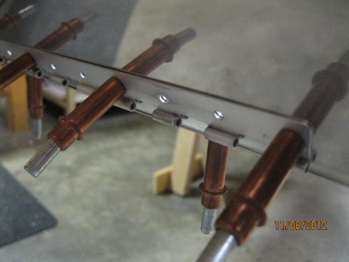 Cowling hinge on bottom firewall.