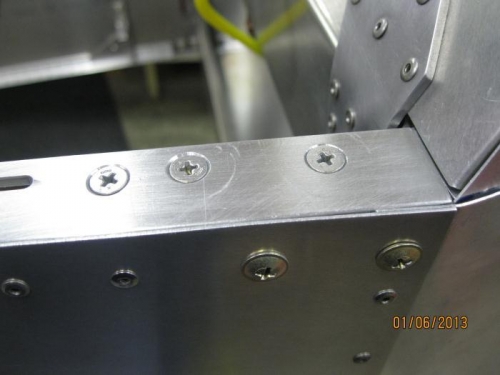 Forward upper longeron attach angles with holes countersunk.