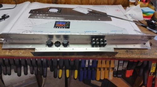 Inside of lower panel. Breakers and 12 volt accessory panel.