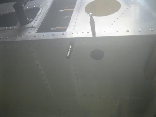 Cutout hole in fwd fuselage floor for the gear leg.